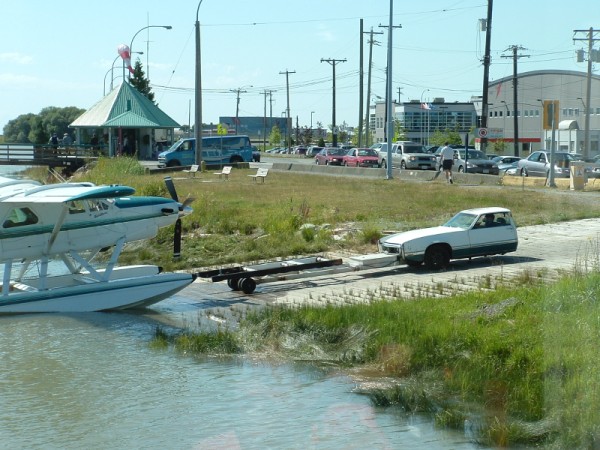 Seaplane and half-truck tow vehicle