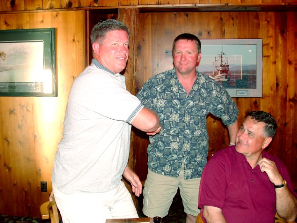 Amor Davis receiving his prize for greates total poundage of fish