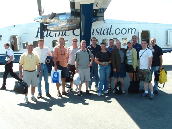 Group shot outside airplane