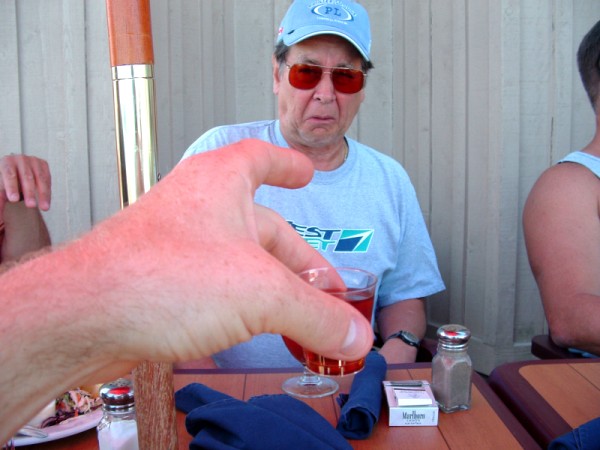 Mike Chaput offers Ron Whipple another drink