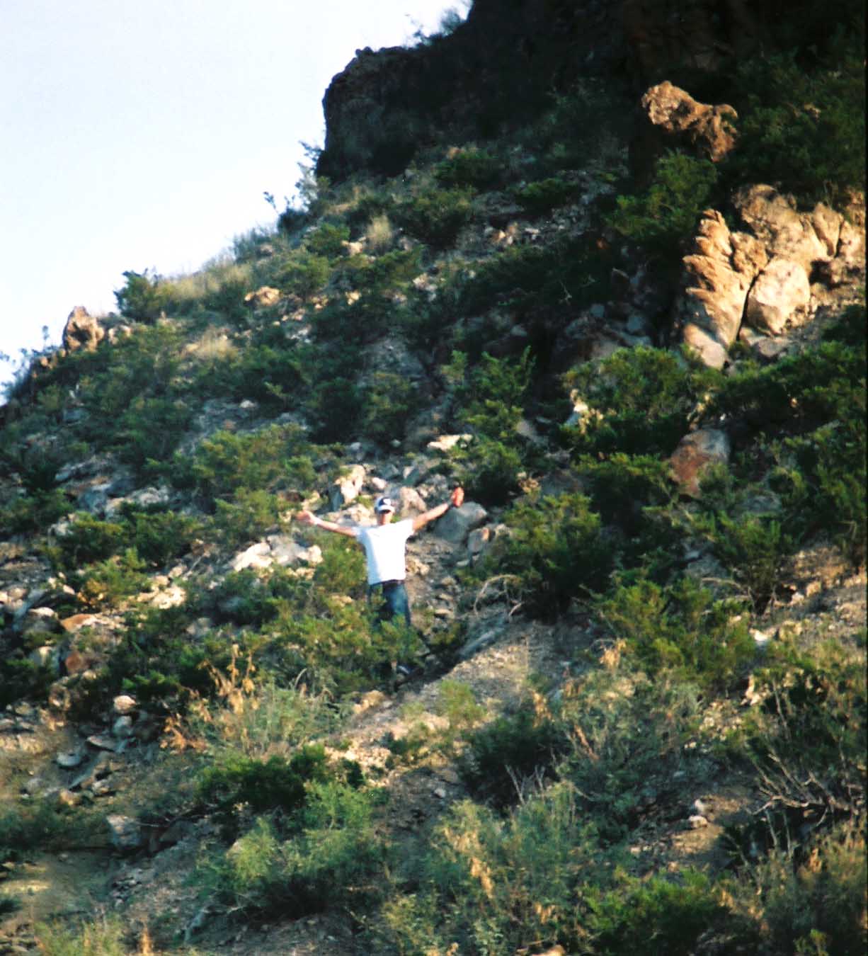 Eric Whipple climbs hill overlooking Luna's Jacal